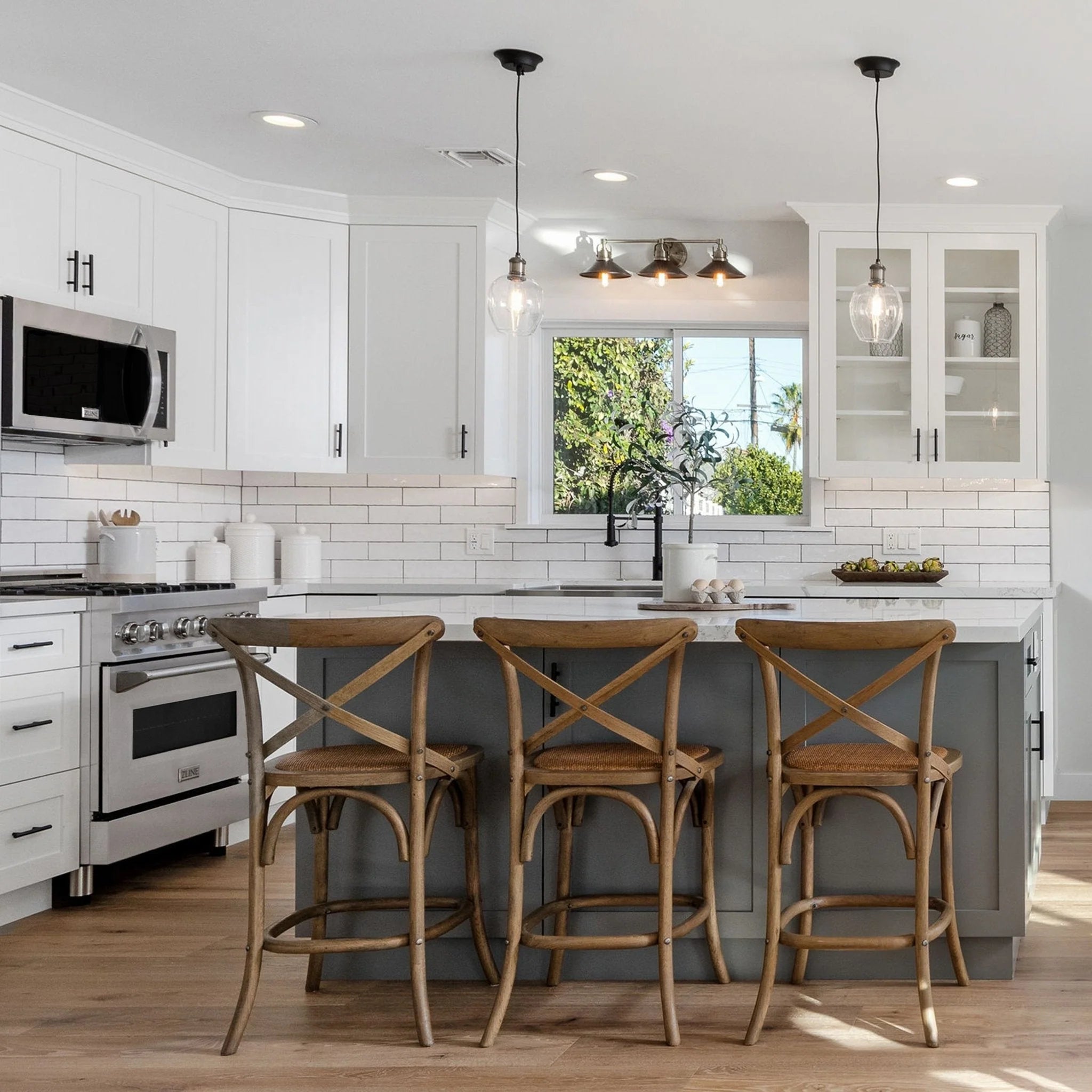 Kitchen with stainless gas range and built-in over-the-range microwave