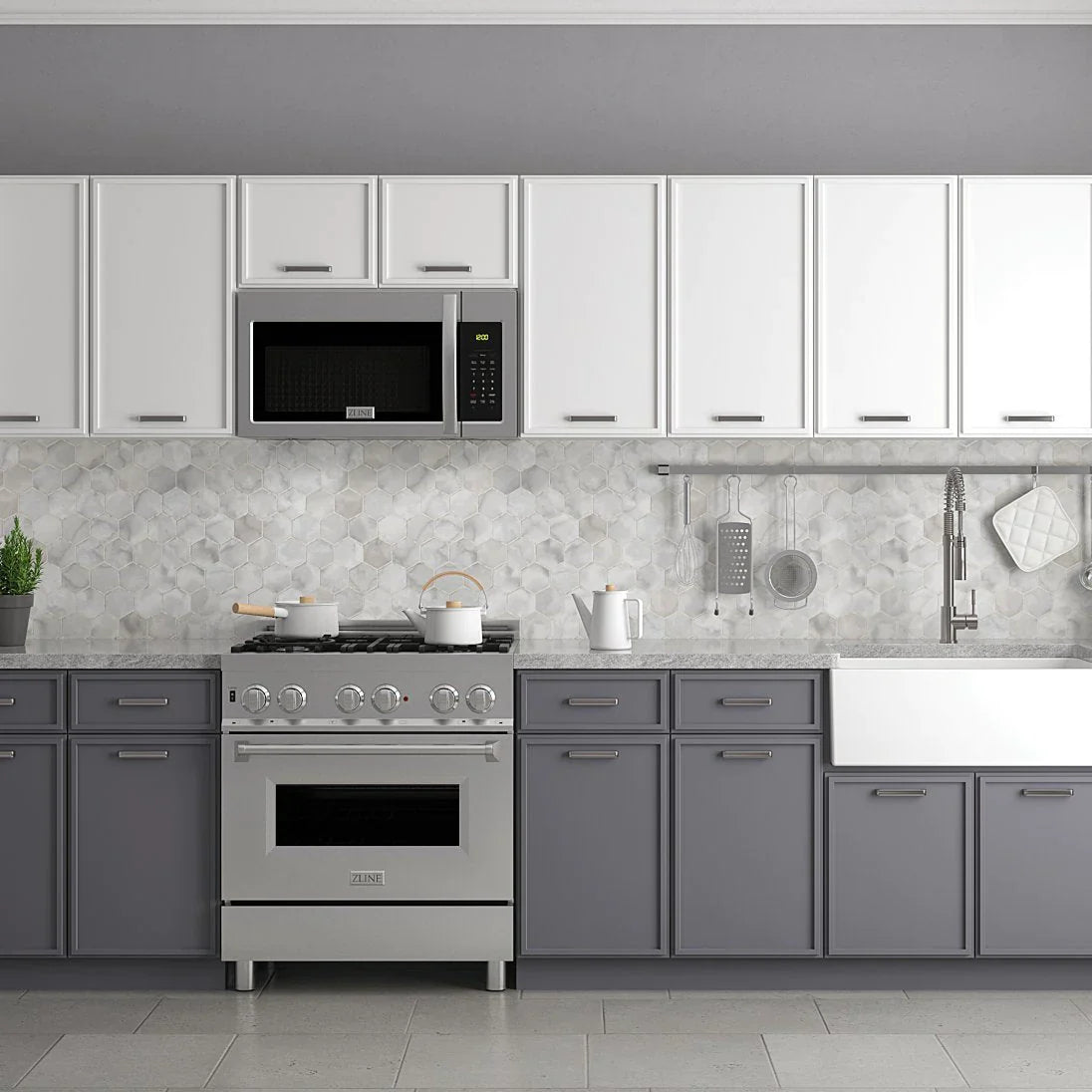 Over-the-range microwave and stainless gas range beneath white cabinet doors
