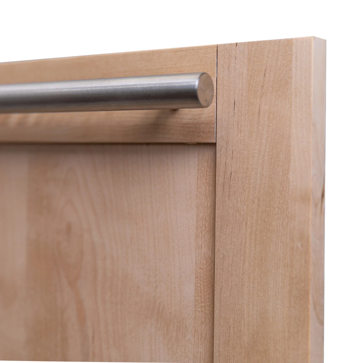 Modern stainless handle over unfinished wood dishwasher door edge