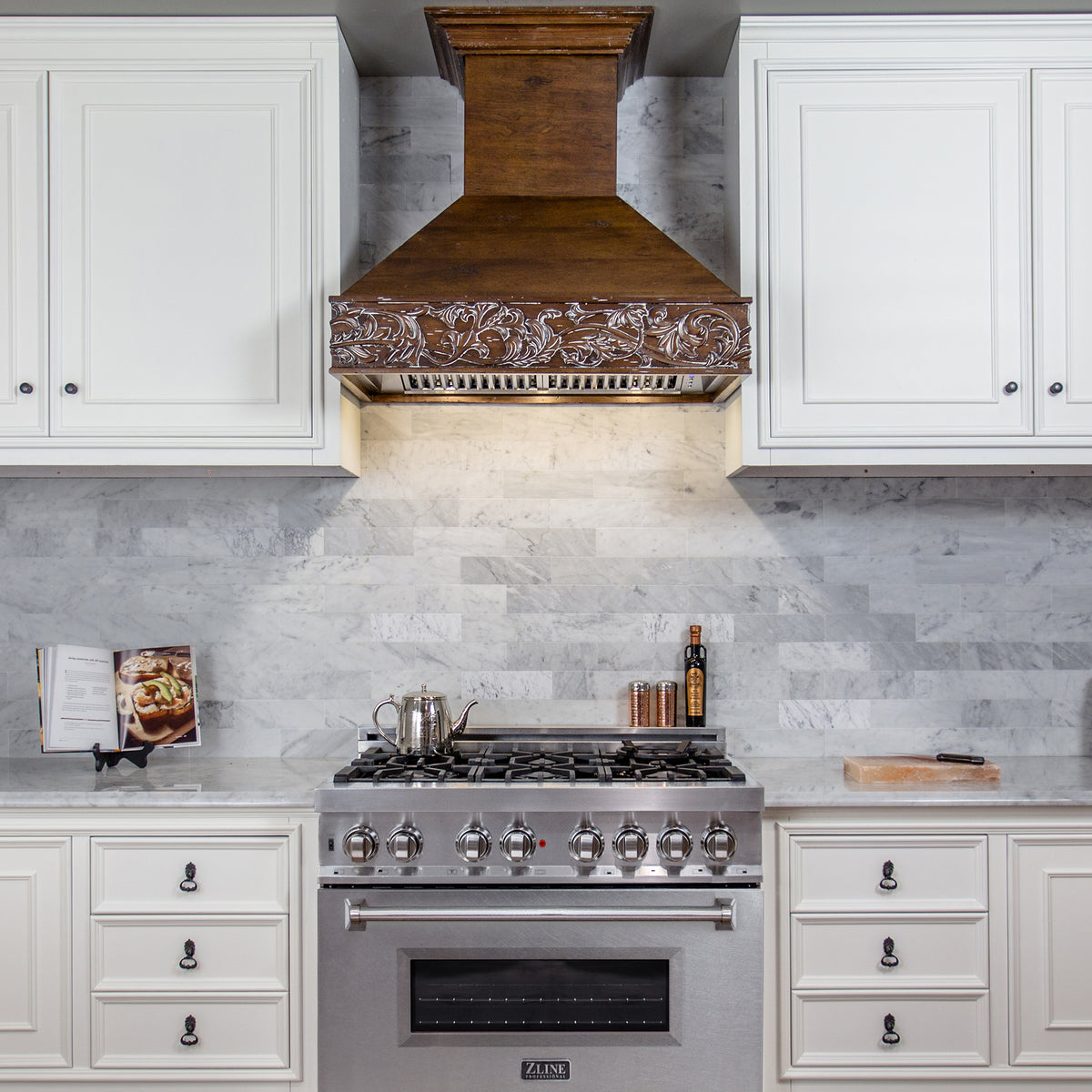 Satin stainless dual fuel range with cooktop burners and glass oven door window