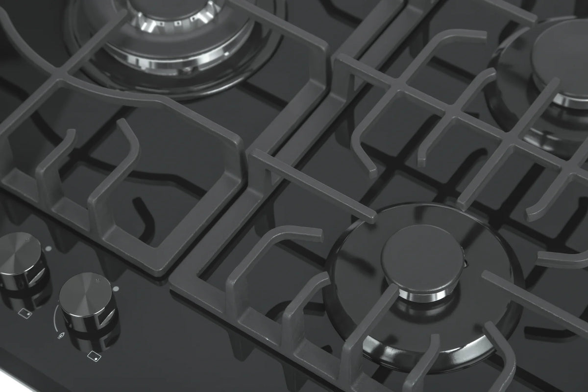 Close-up of black cooktop grates, burner rings, and front control knobs