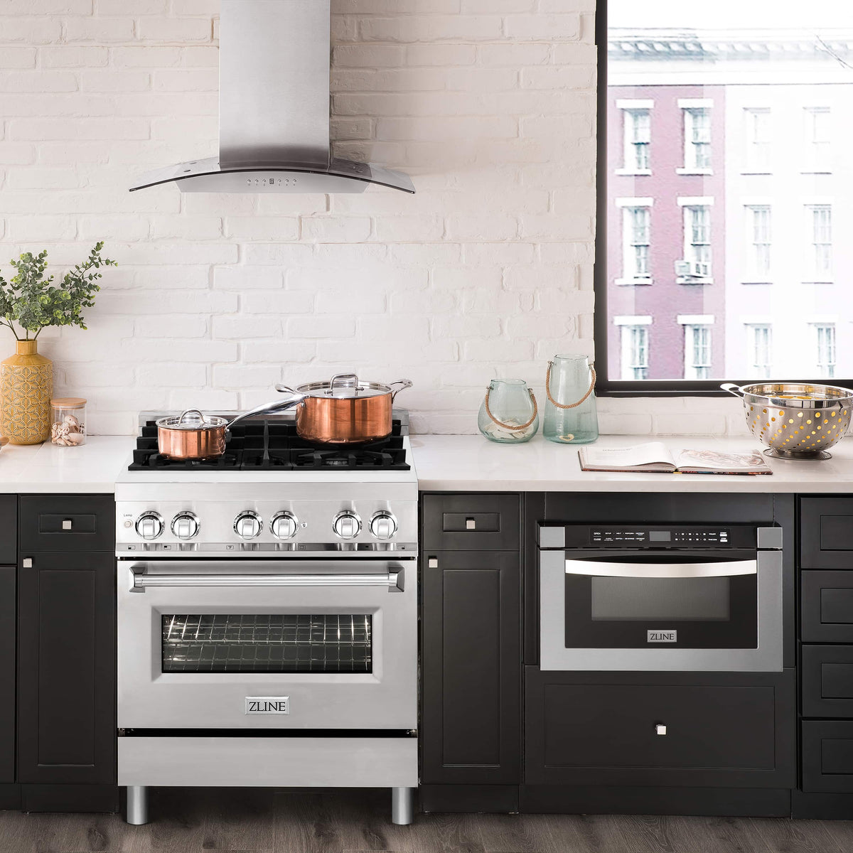 Stainless steel dual fuel range with range hood and built-in wall oven