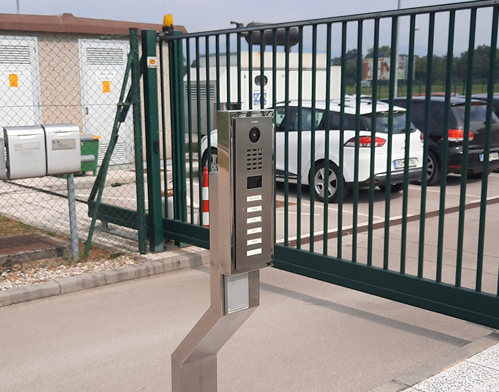 DoorBird stainless steel video door station, side view on post with call button panel