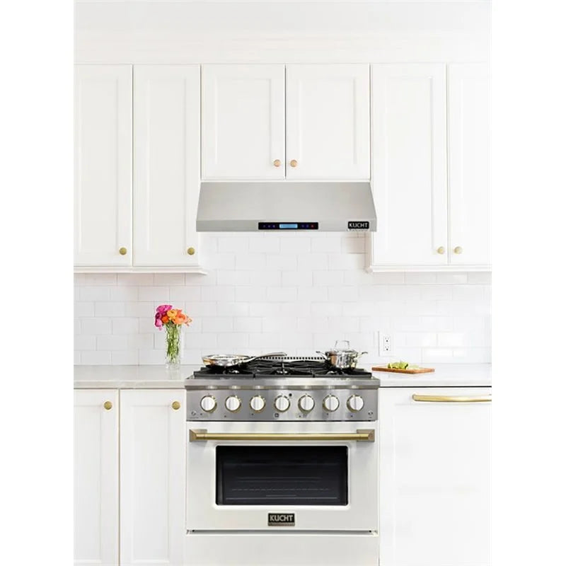 White gas range in kitchen, five burners, gold bar handle, white convection oven