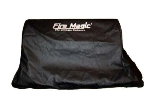 Fire Magic grill cover, dark black with logo and “Ultimate Barbecue” text