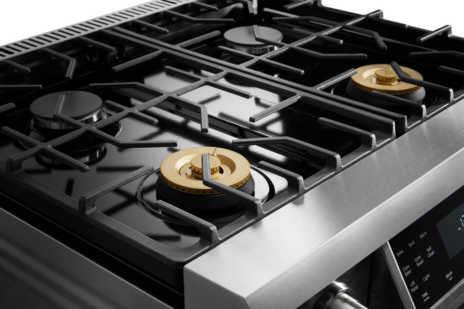 Stainless steel gas cooktop with four burners and black grates
