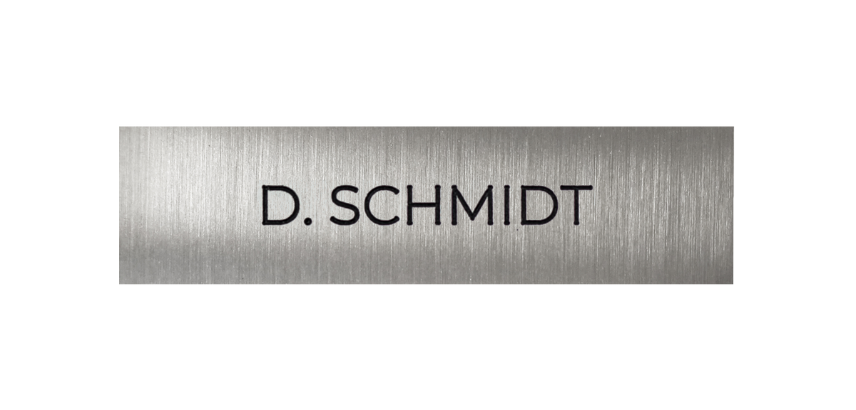 Stainless steel nameplate with engraved text "D. SCHMIDT"