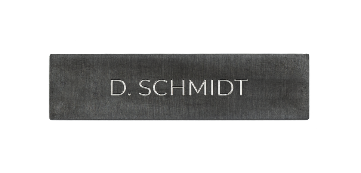 Titanium-coated stainless steel nameplate with engraved D. SCHMIDT