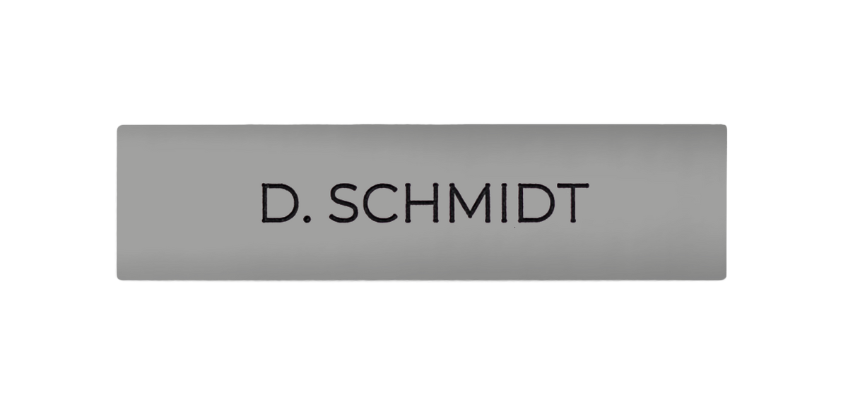 White aluminum nameplate with engraved "D. SCHMIDT" text