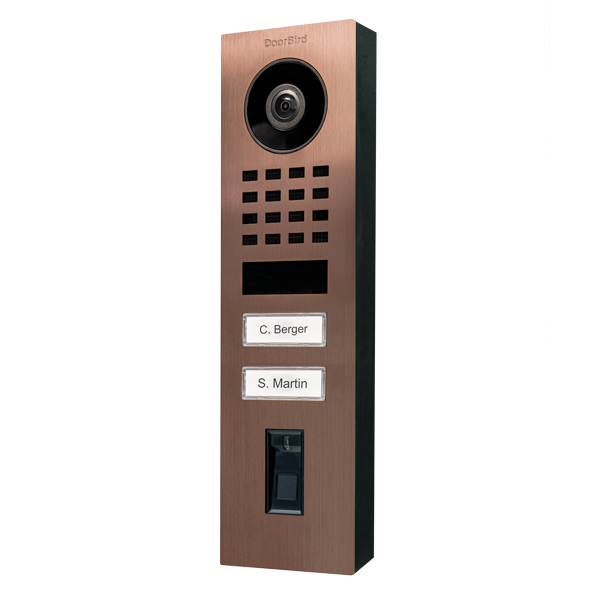 Bronze DoorBird video door station with camera lens, speaker grille, and two name plates