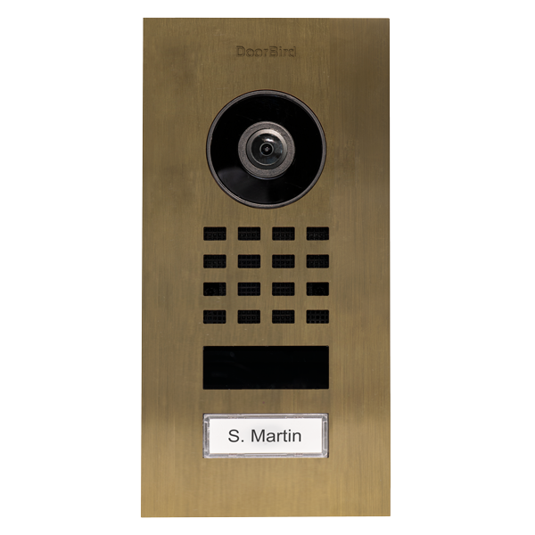 DoorBird flush-mount video intercom in burnished brass, camera, keypad, call button, nameplate
