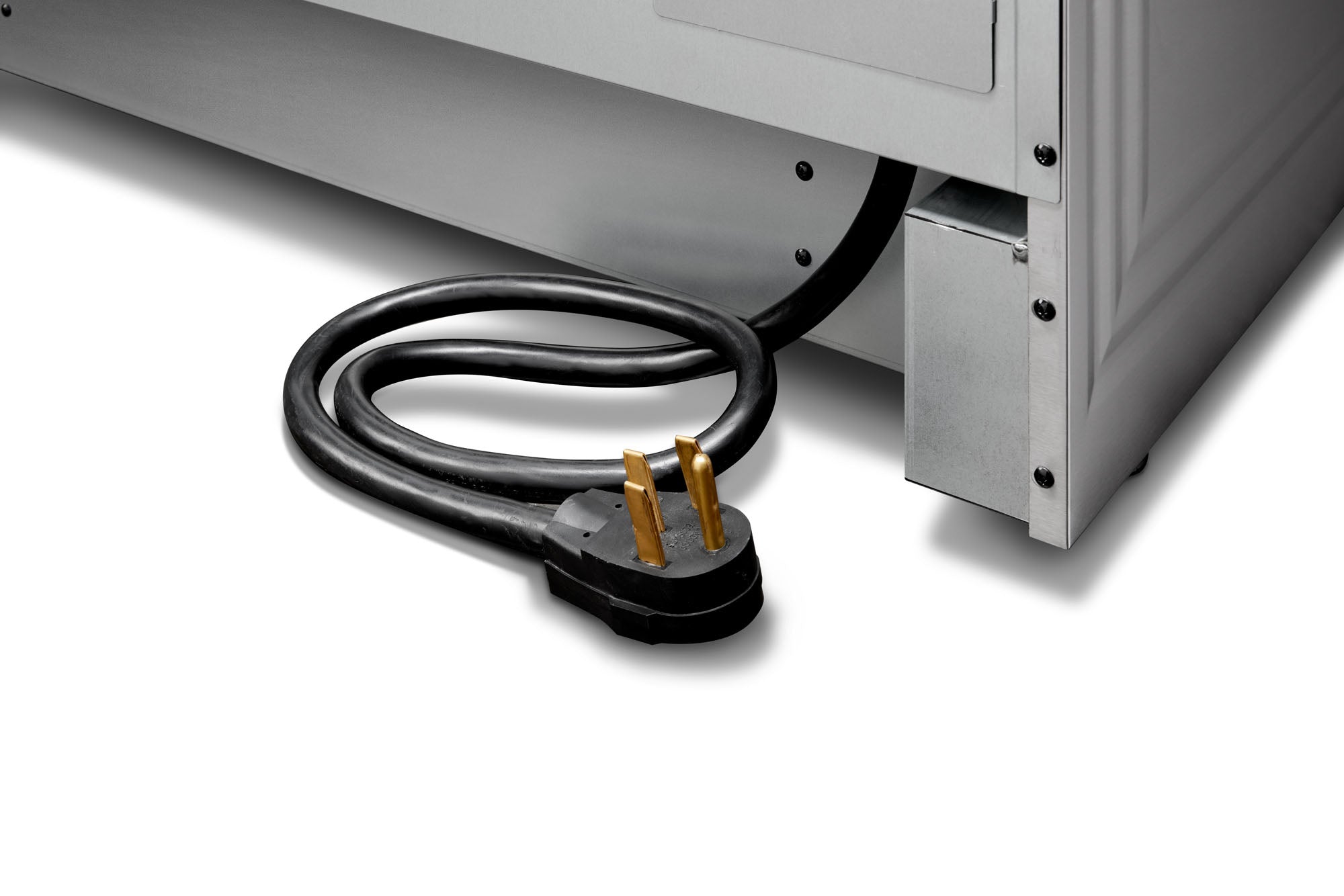 Power cord with plug attached to the bottom of a stainless steel electric range