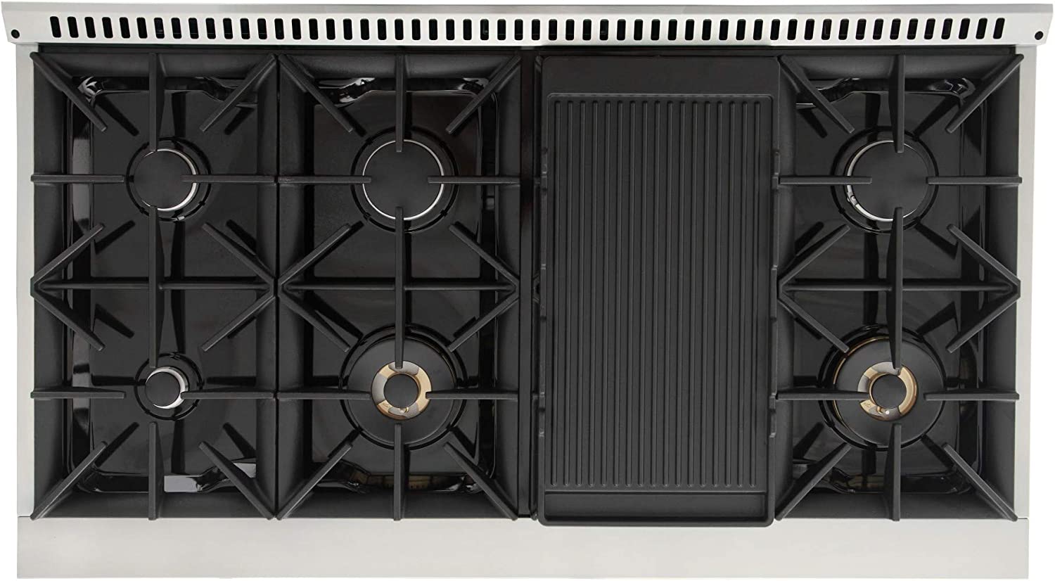 Open gas cooktop with black cast grates and heat shield panel