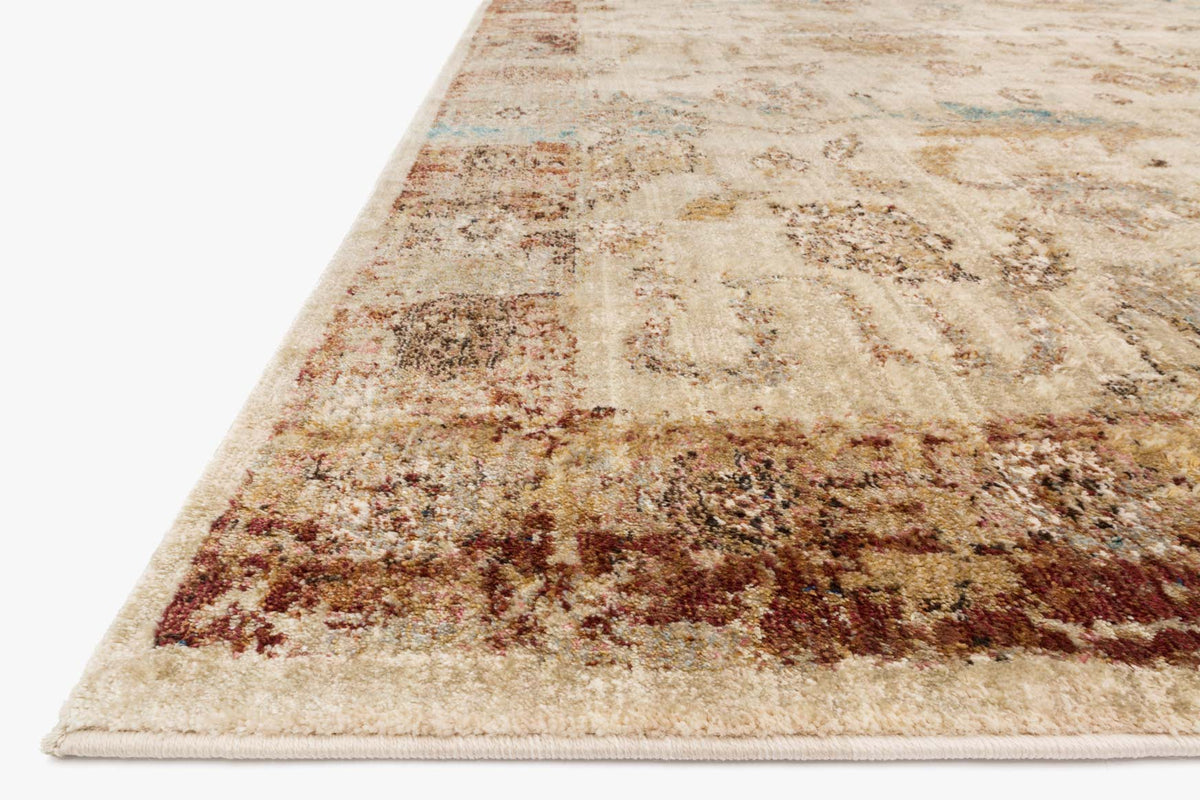 Corner view rectangular area rug in beige with rust and blue-gray pattern