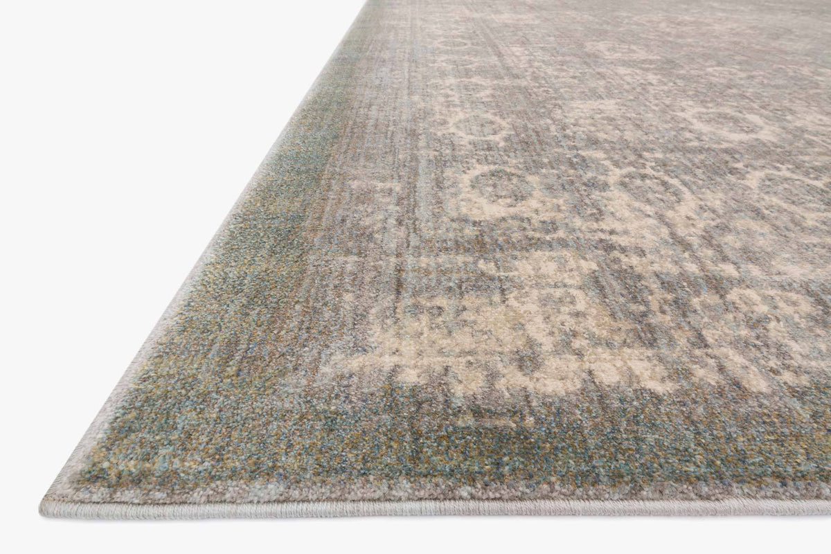 Grey and sage distressed rug corner view, power-loomed textured surface