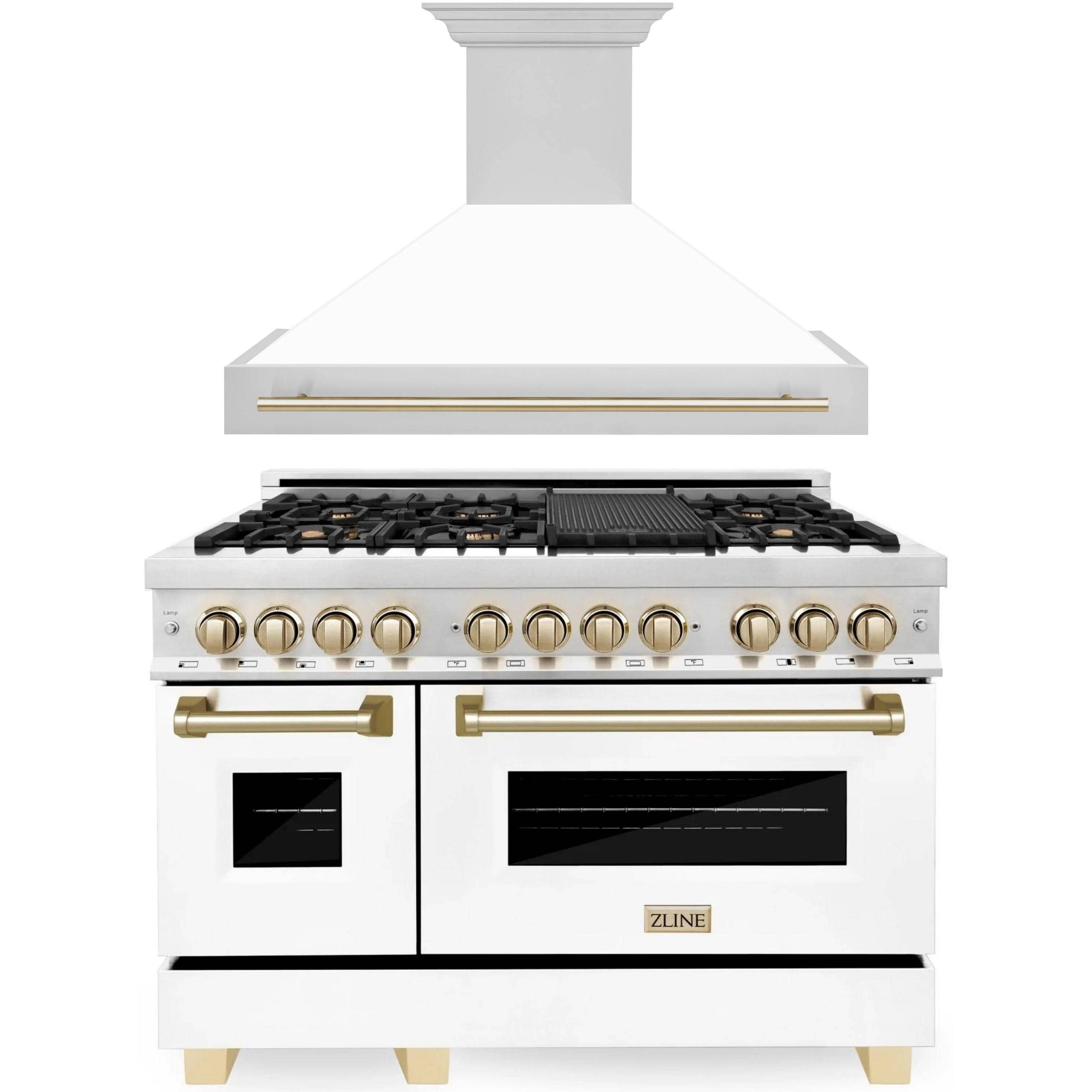 White dual-fuel range with stainless hood, gold trim, black burners and two ovens