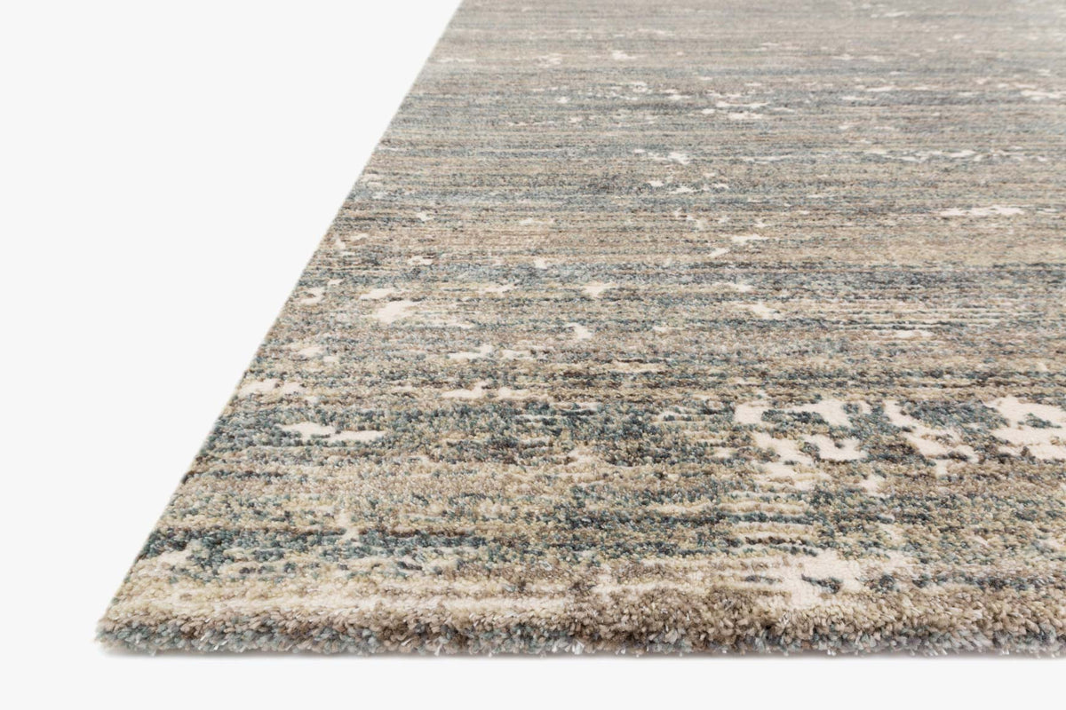 Contemporary power-loomed rug corner view with distressed horizontal stripes in fog gray