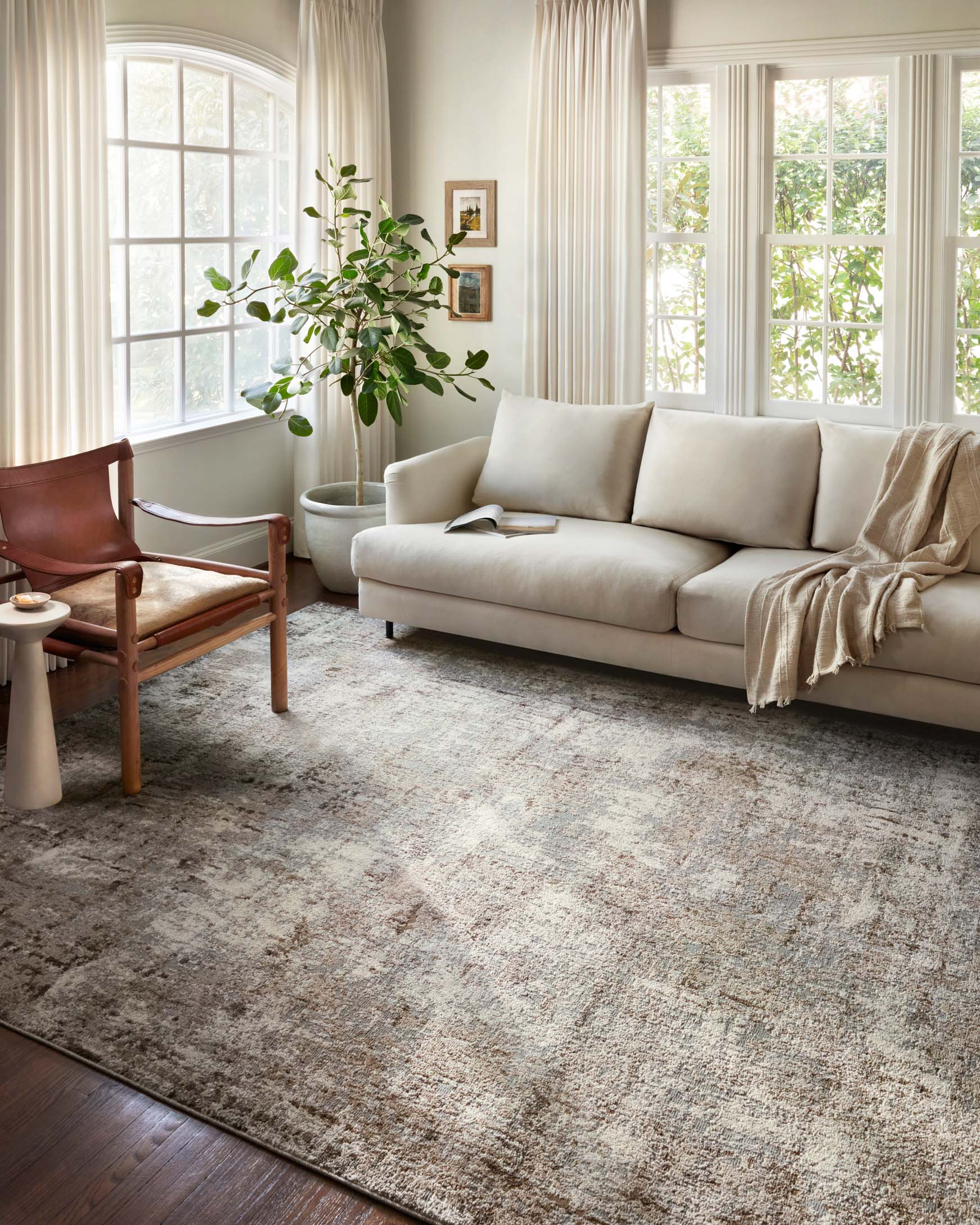 Natural and mocha abstract distressed power-loomed rug, large size on floor