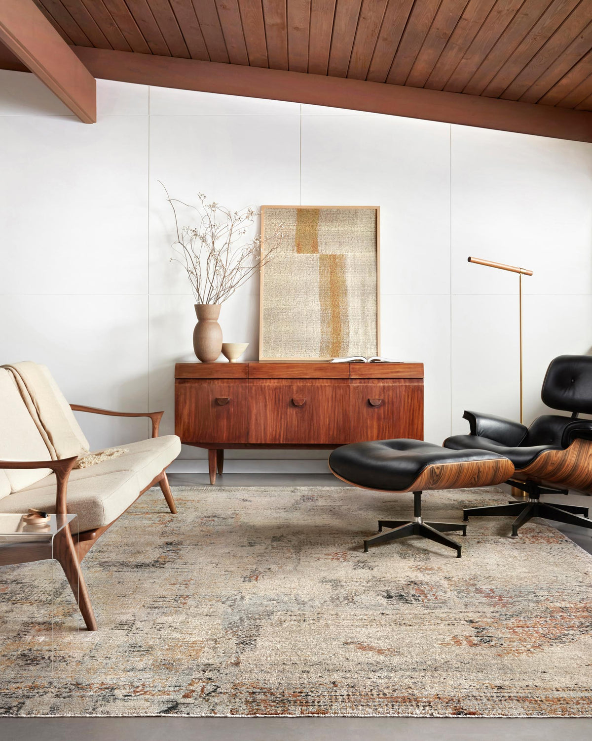 Rectangular power-loomed rug in sand tones with abstract distressed motifs in blue-gray and rust