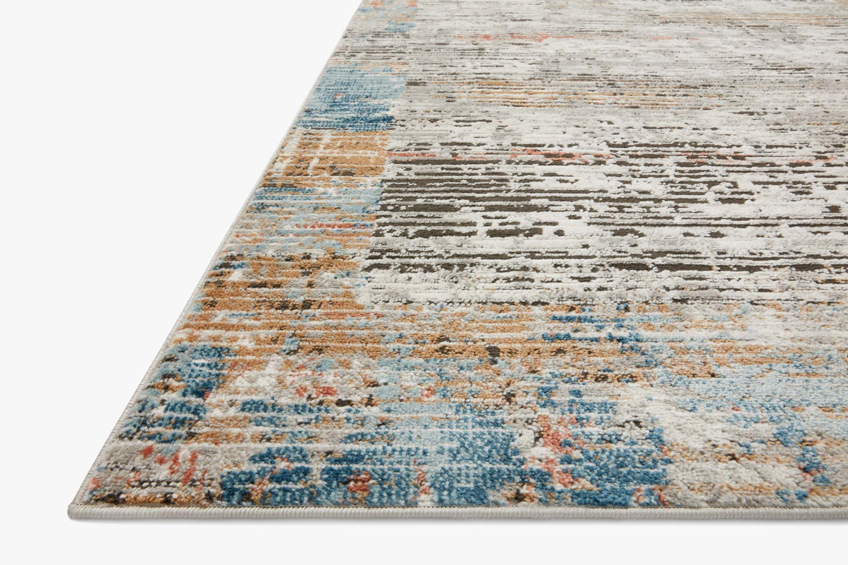 Abstract power-loomed rug corner with distressed bands in cream, blue, and orange tones