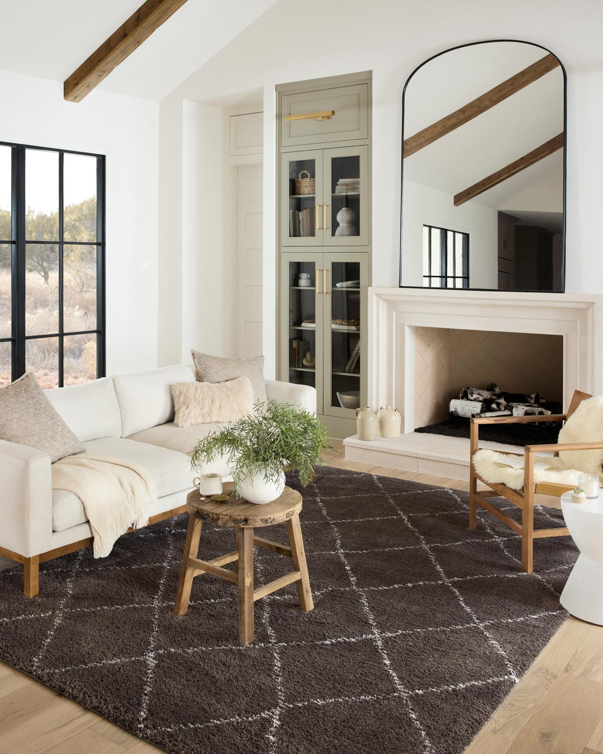 Shag rug in dark bark brown with light grey diamond pattern.