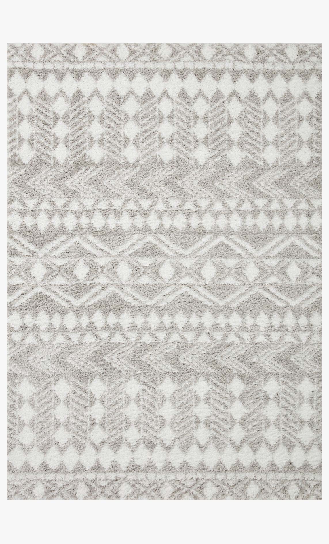 Grey and white shag rug with geometric diamond and zigzag pattern.