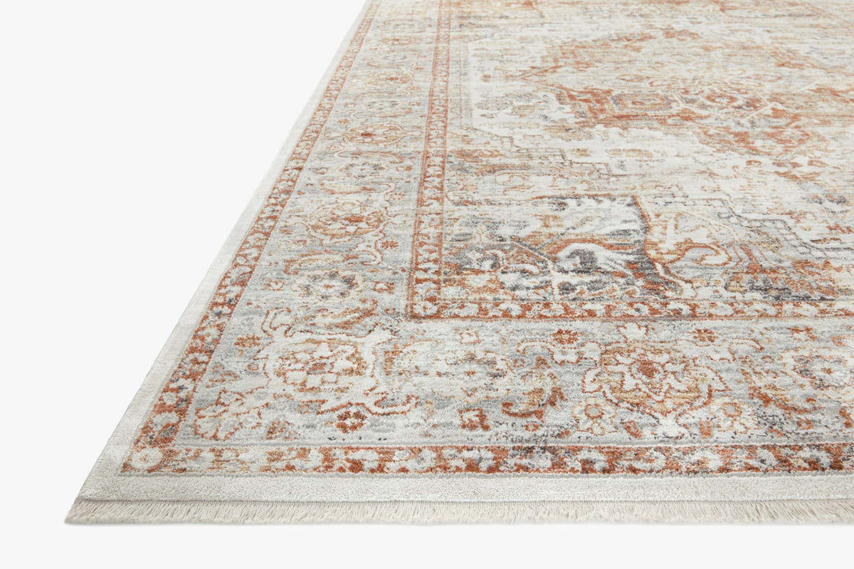 Ivory and sunset power-loomed area rug corner view with detailed ornamental border
