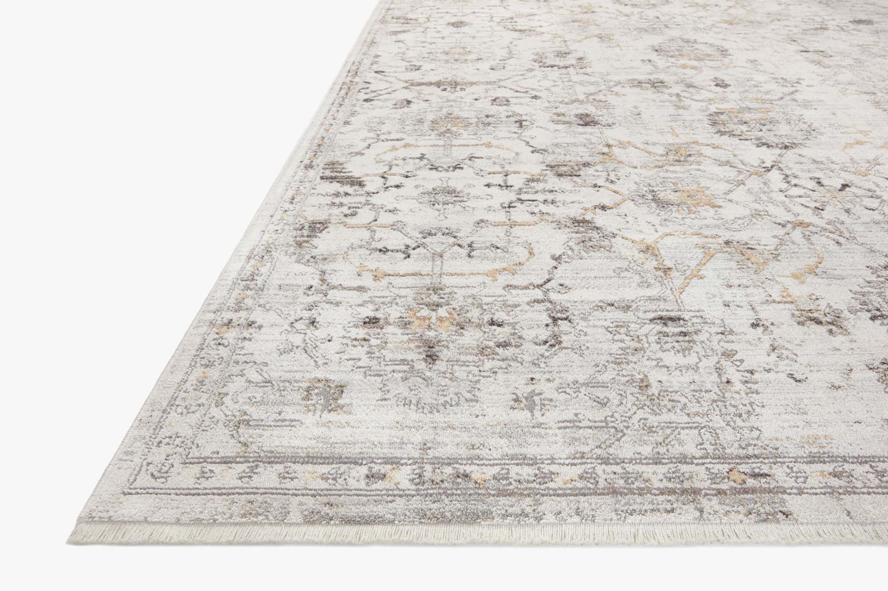 Corner view of ivory and dove traditional rug with distressed geometric border