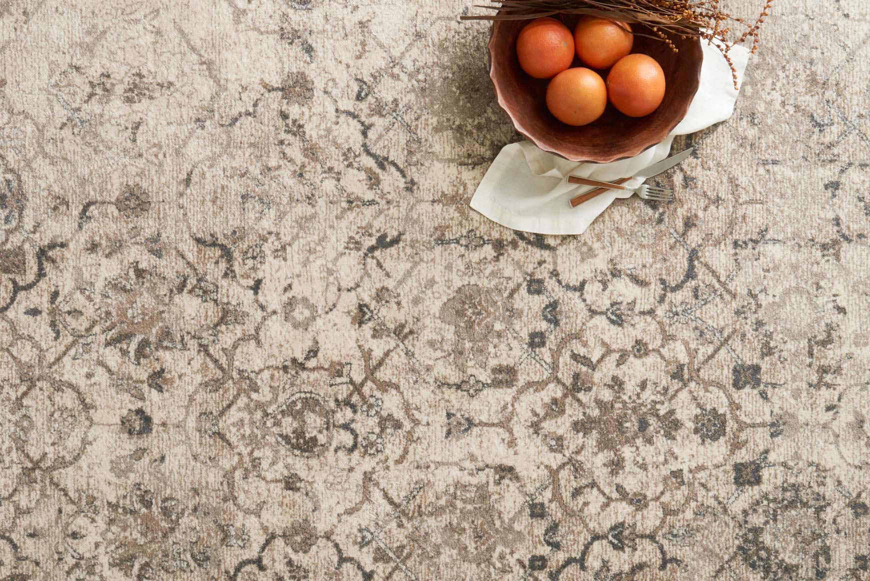 Sand area rug with close-up allover damask pattern and gray-blue motifs