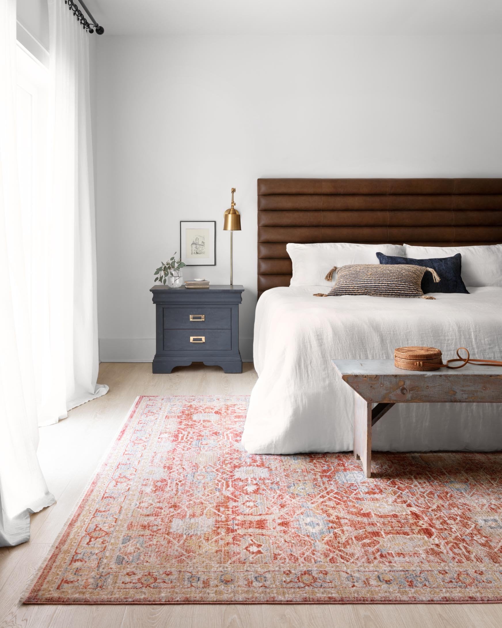 Red and ivory traditional power-loomed rug, flatwoven look, distressed motif border.