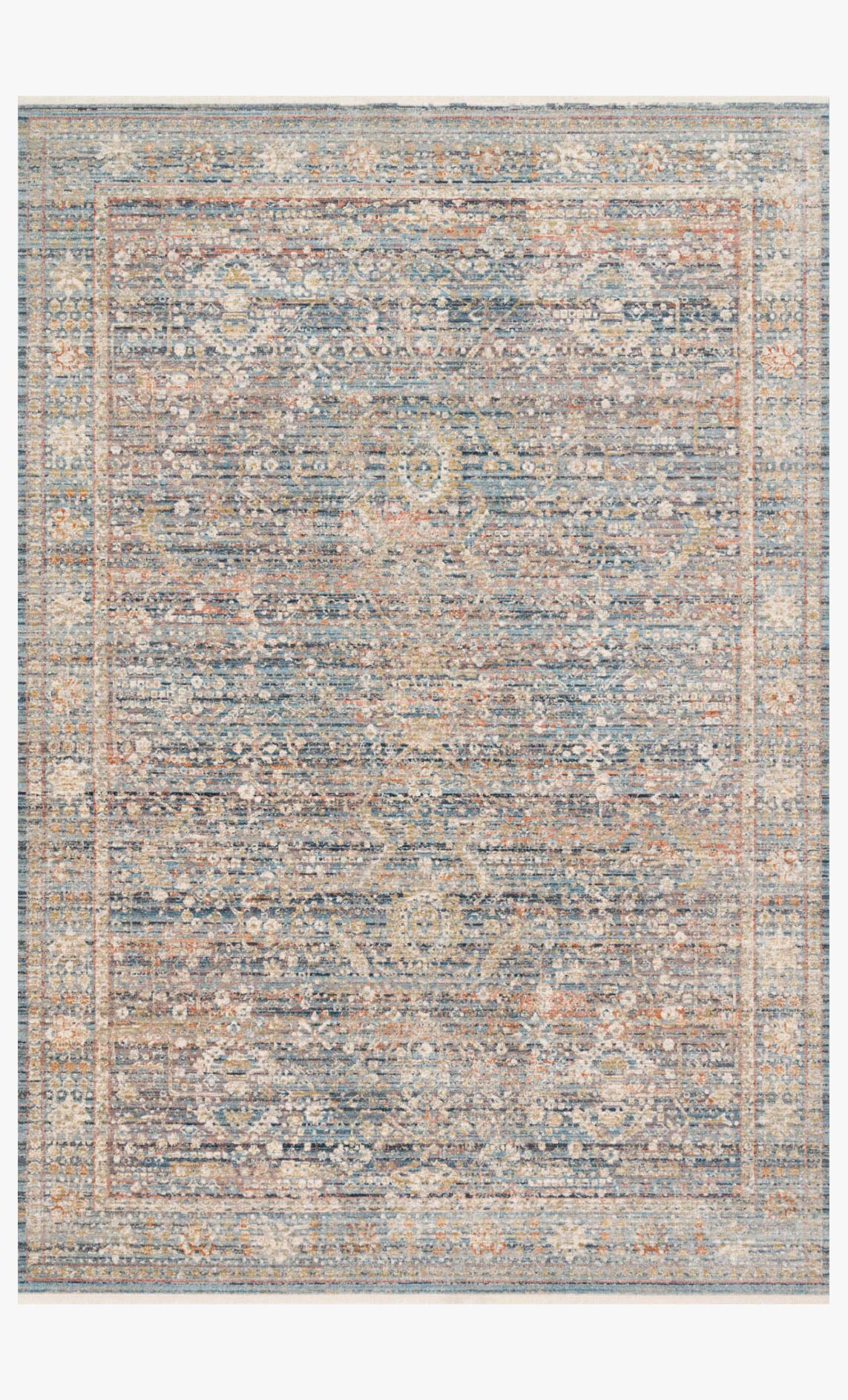 Traditional power-loomed rug with distressed geometric pattern in blue and sunset tones