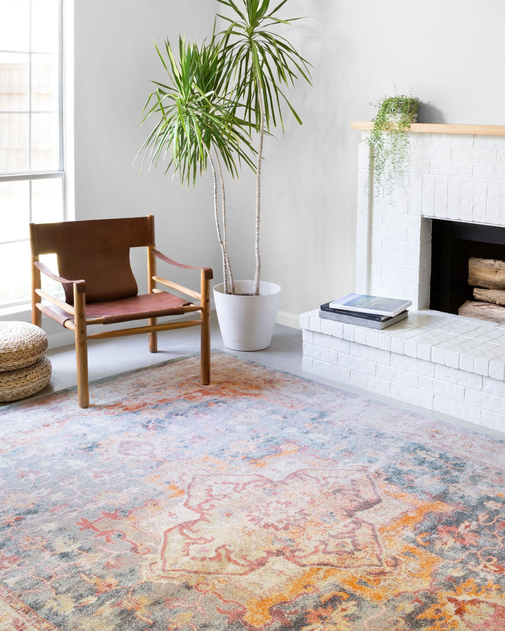 Transitional rug with light blue, ivory and rust abstract medallion pattern