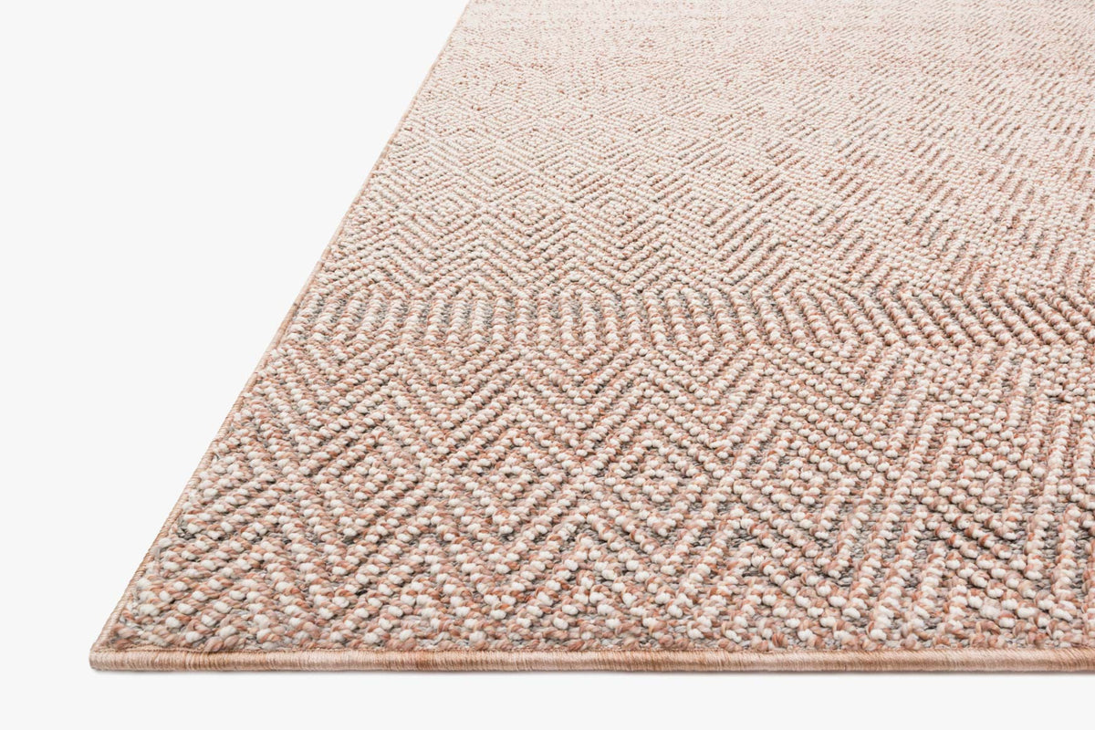 Blush and ivory power loomed rug corner, close texture and border detail