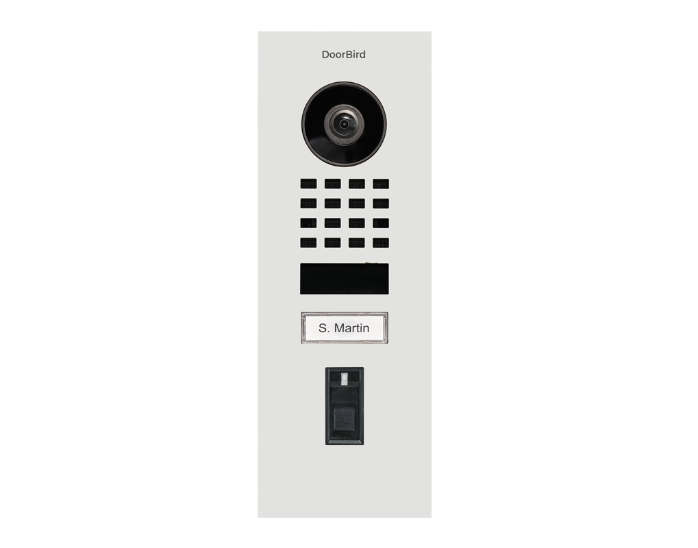 DoorBird flush-mount IP video door station in traffic white with camera, keypad, and nameplate