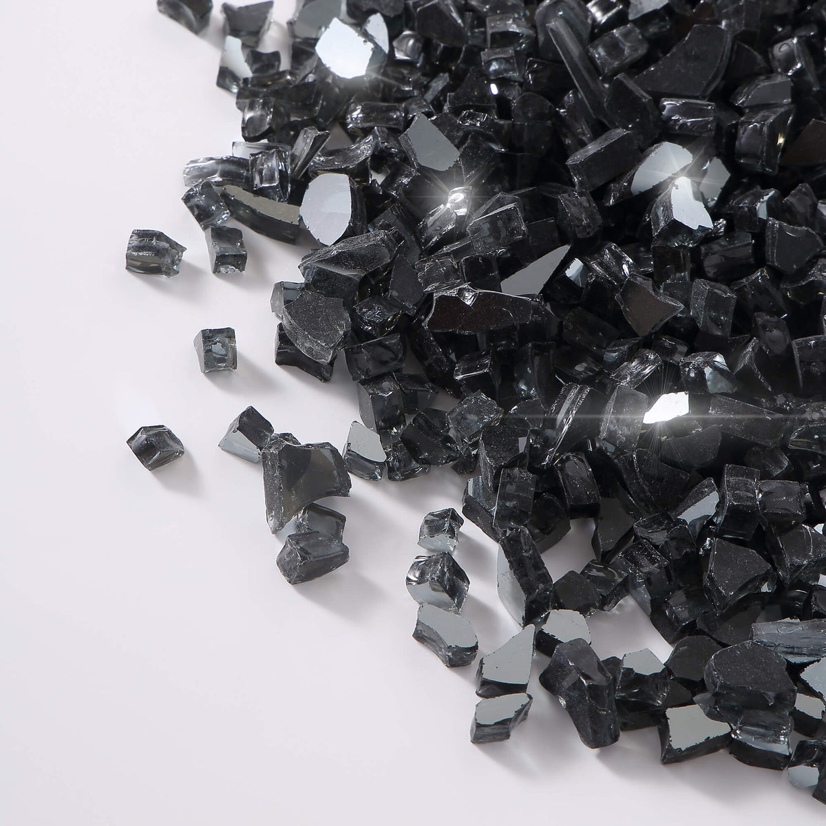 Close-up of black tempered fire glass chunks with reflective facets