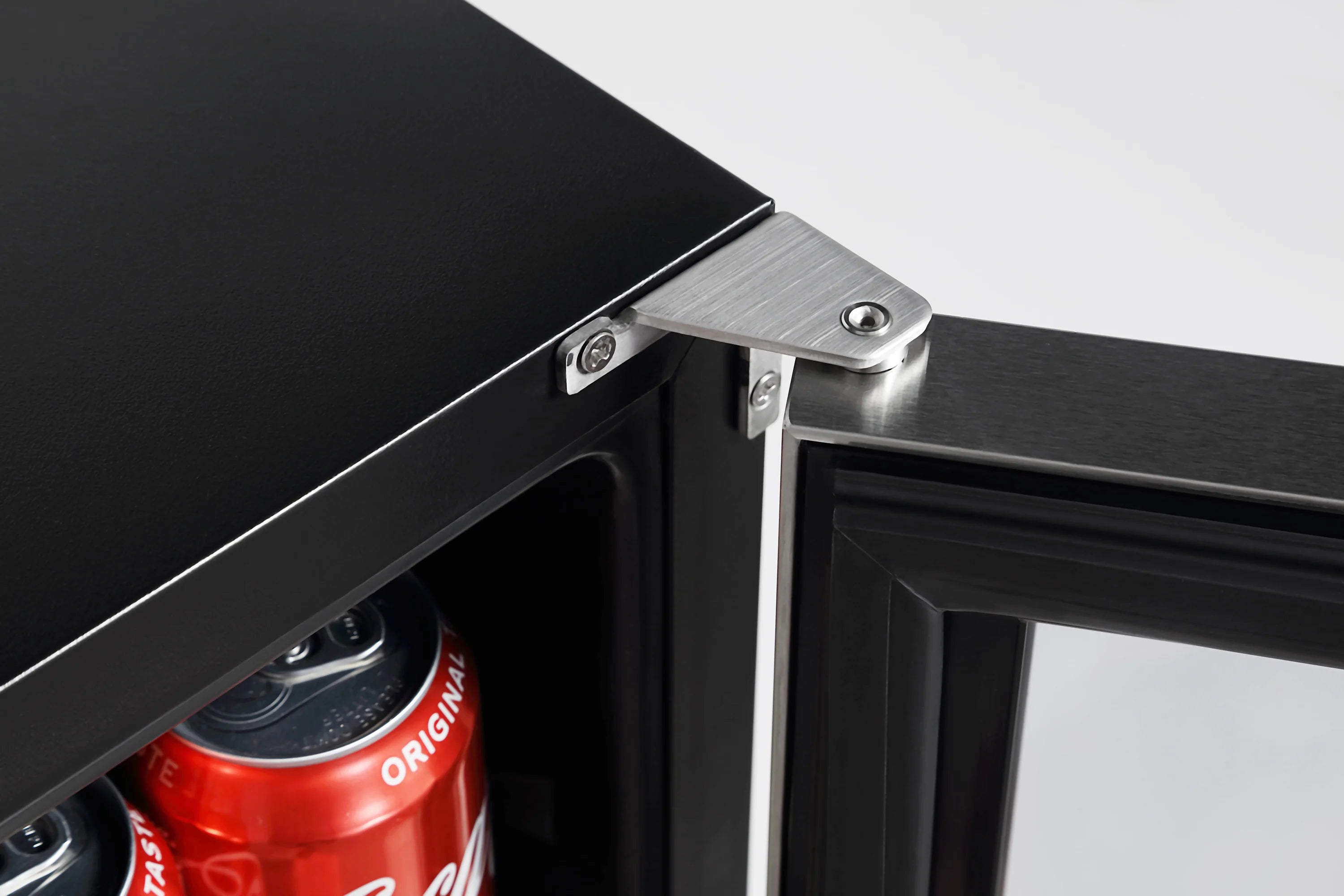 Stainless beverage fridge door hinge and edge hardware, black top panel