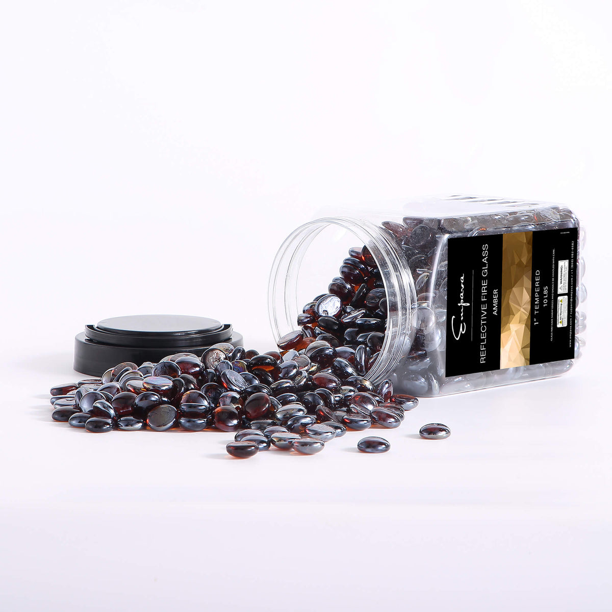 Jar and scattered amber reflective fire glass beads, dark glossy oval pieces