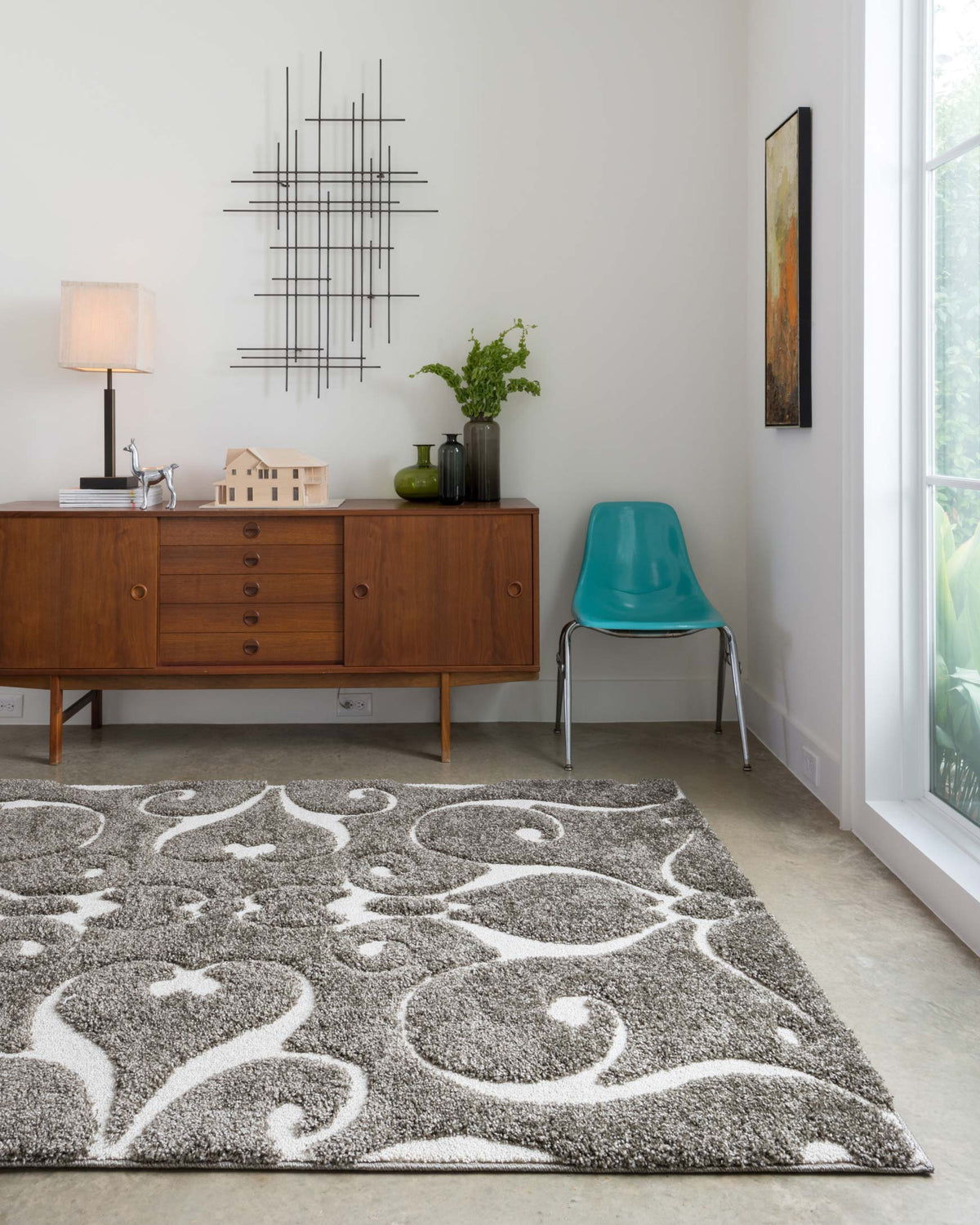 Smoke gray area rug featuring ornate white scrolling and floral motifs, rectangular