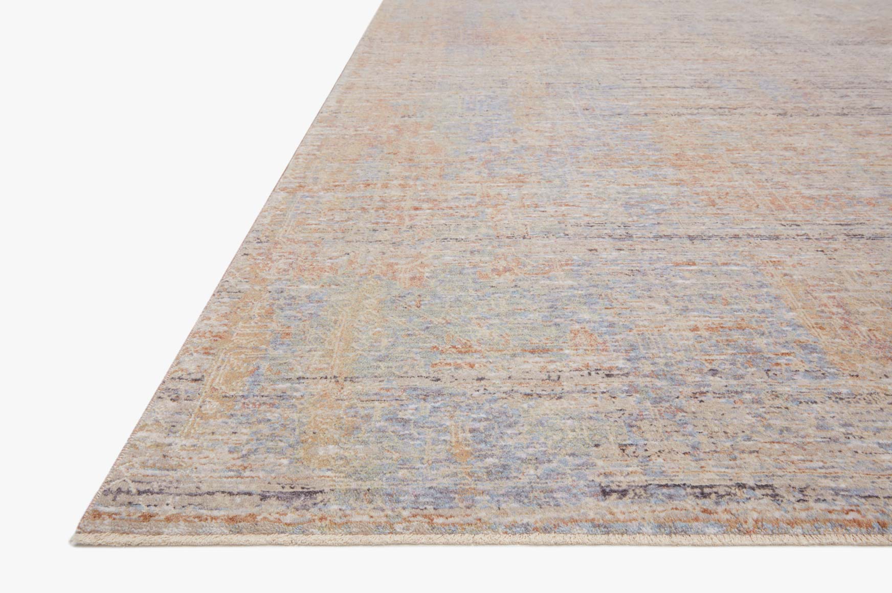 Light blue and beige border on distressed power-loomed area rug, corner view