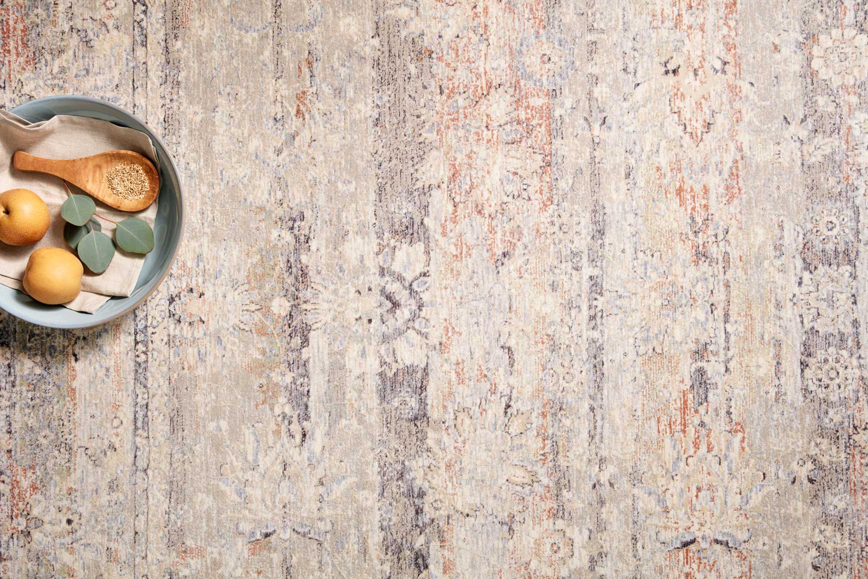 Transitional power-loomed rug with cream base, blue-gray and rust distressed pattern