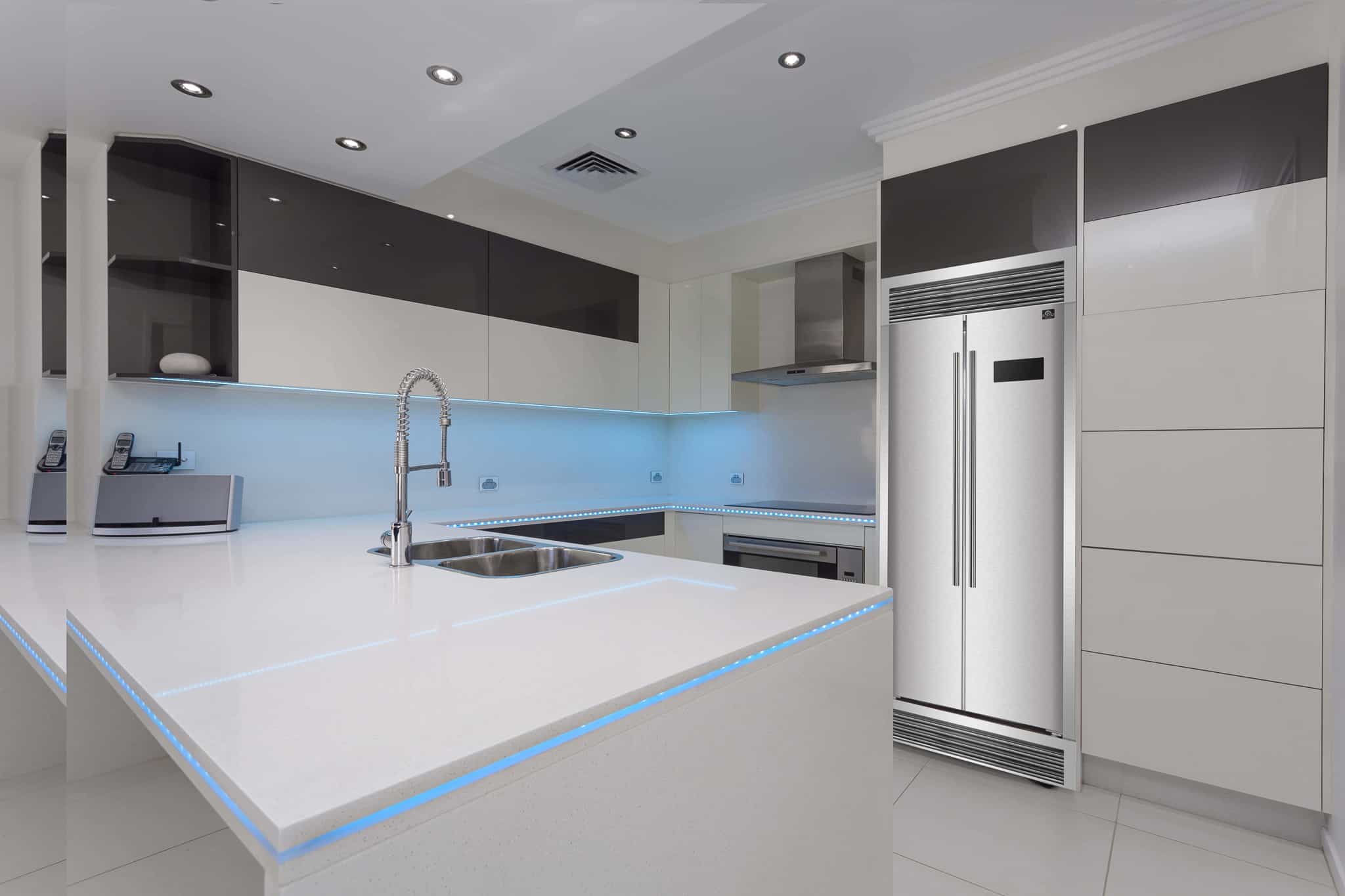 Stainless side-by-side refrigerator with vertical handles and digital control display