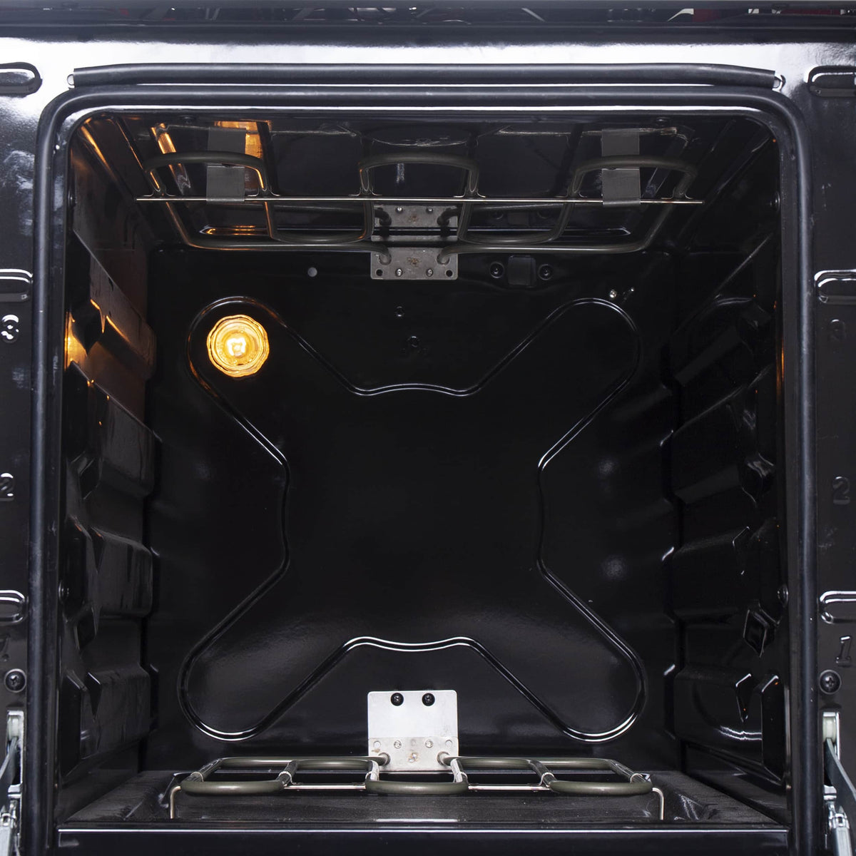 Stainless electric range oven interior with oven light and visible heating components