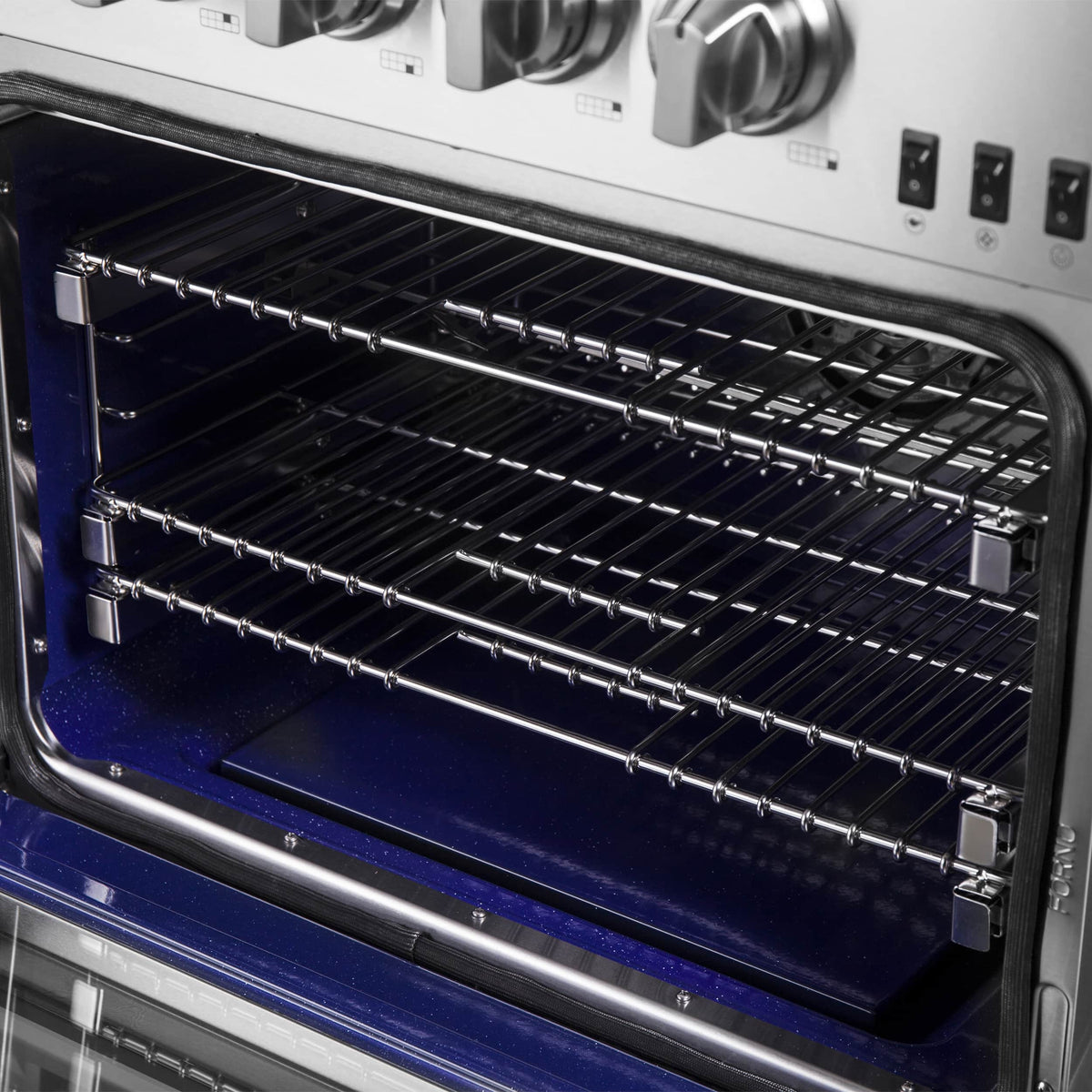 Open oven door showing wire oven racks and interior heating surface