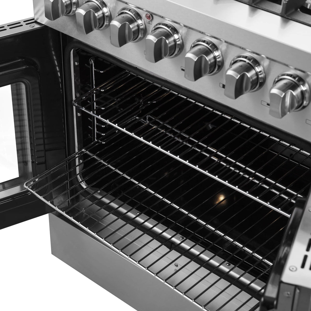 Dual fuel range oven cavity with multiple wire racks and stainless sides