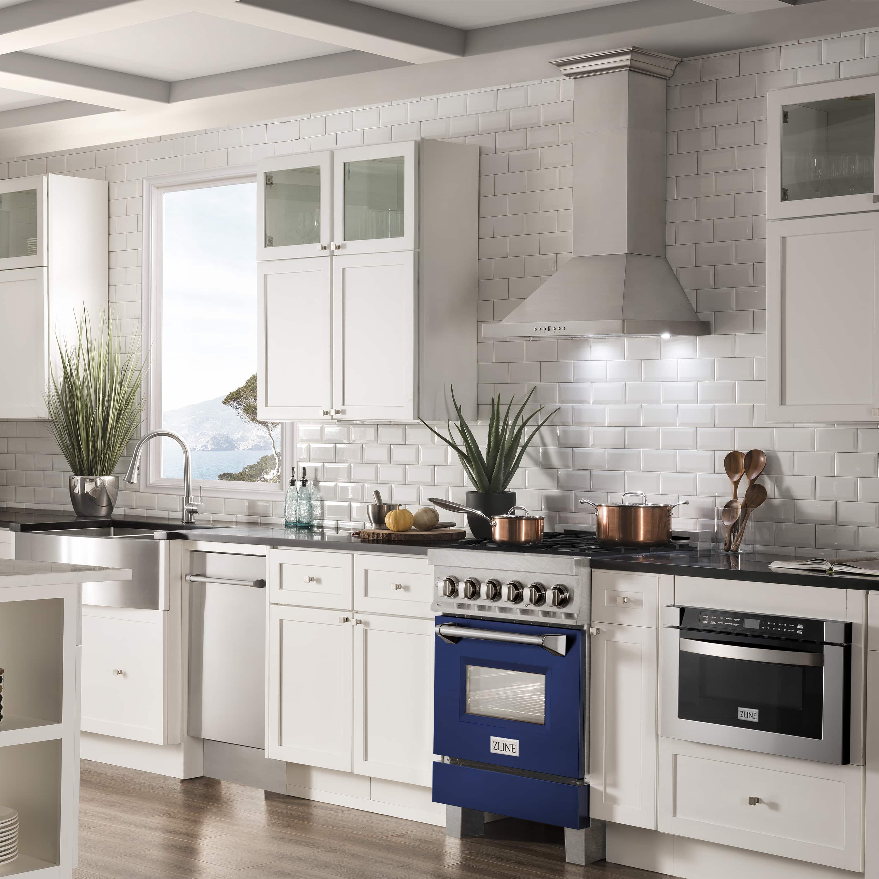 Dual-fuel range with stainless control panel, blue glass oven door and black burners