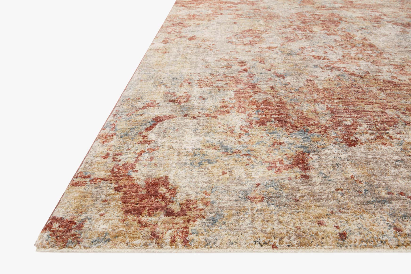 Taupe area rug with brick and rust speckled abstract texture, angled view.