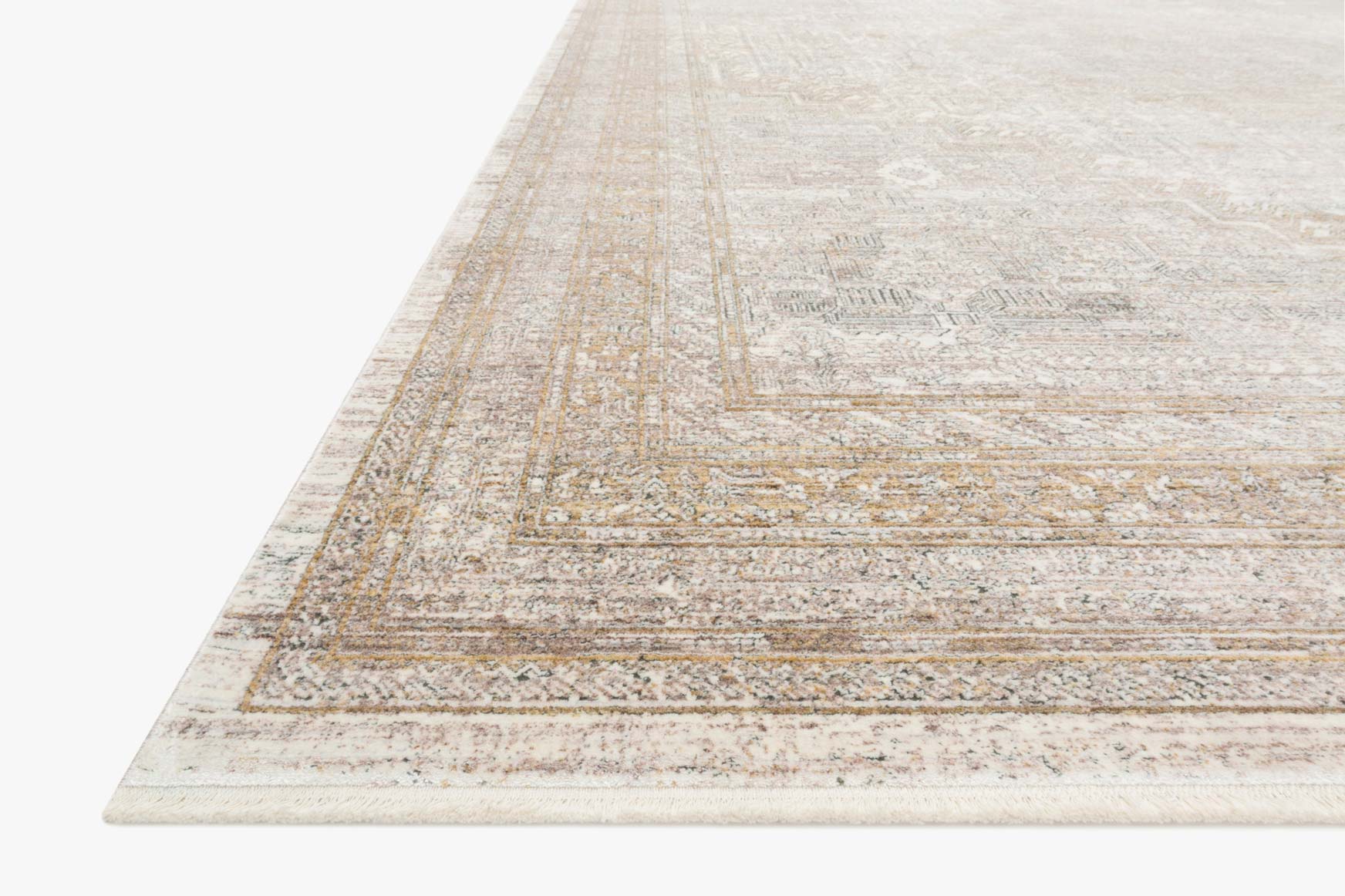 Sand and ivory rug corner with vintage border and geometric linework