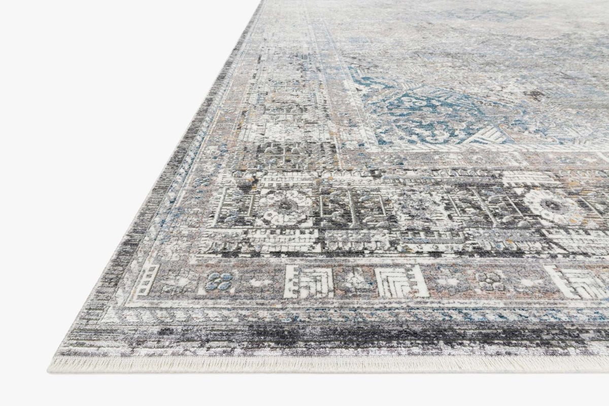 Silver and blue geometric-pattern traditional rug with border and corner details