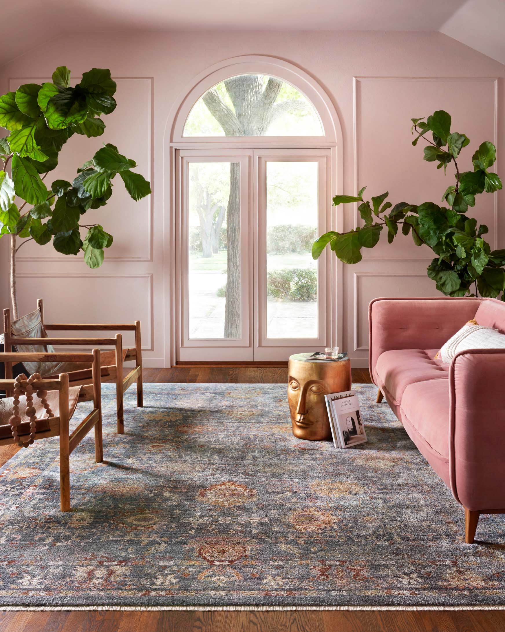 Traditional power-loomed rug with grey base and multi-color distressed motifs, wide border