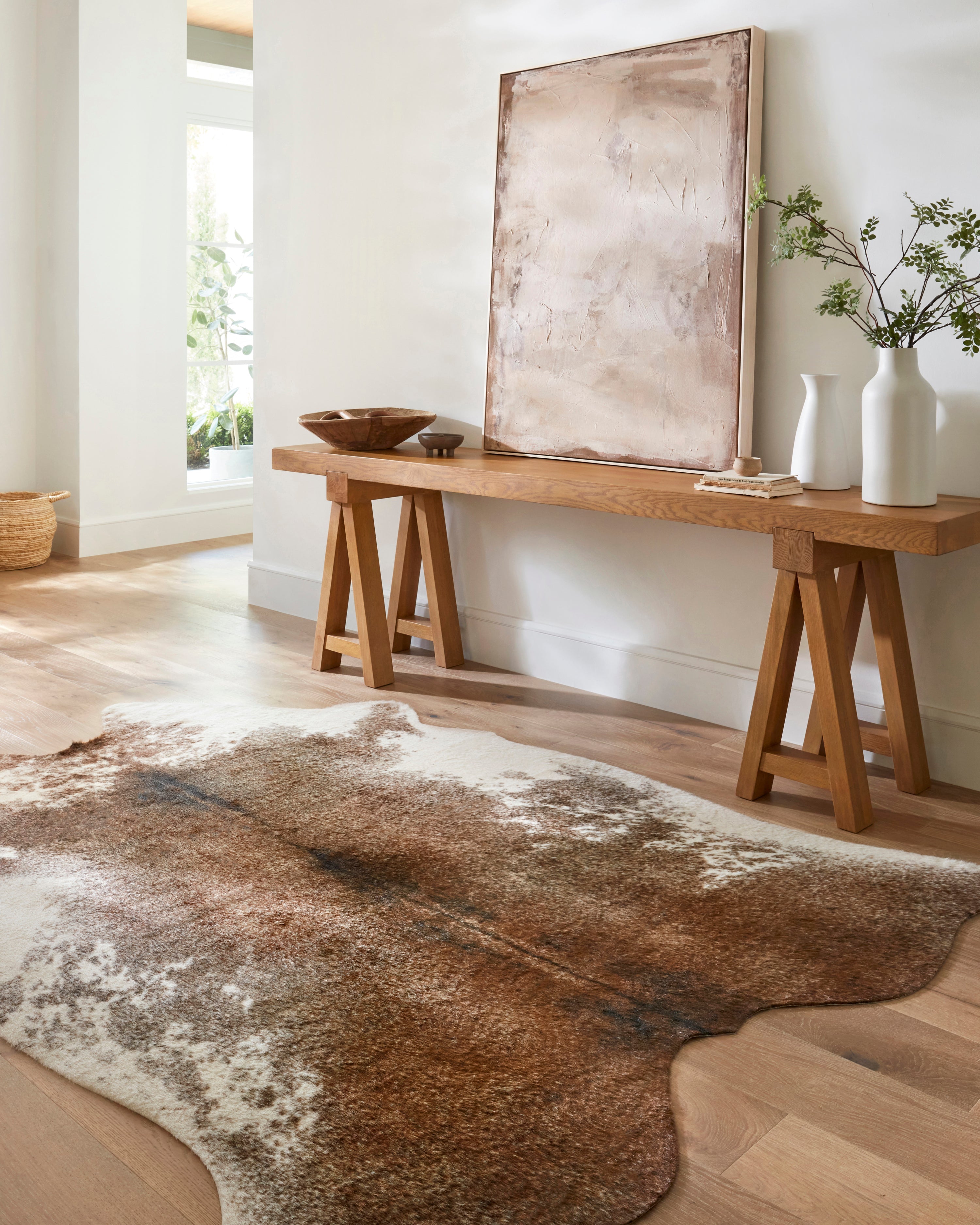 Coffee and ivory abstract area rug with distressed speckled mottling, corner view